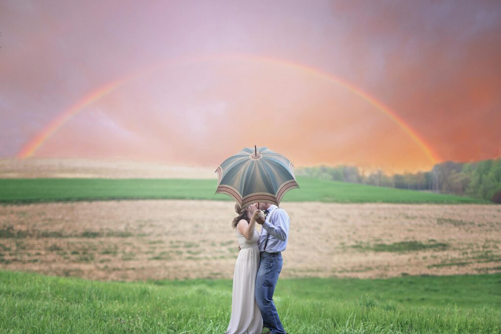 pexels-photo-1067194-1067194 Photo of Couple Holding Umbrella While Kissing