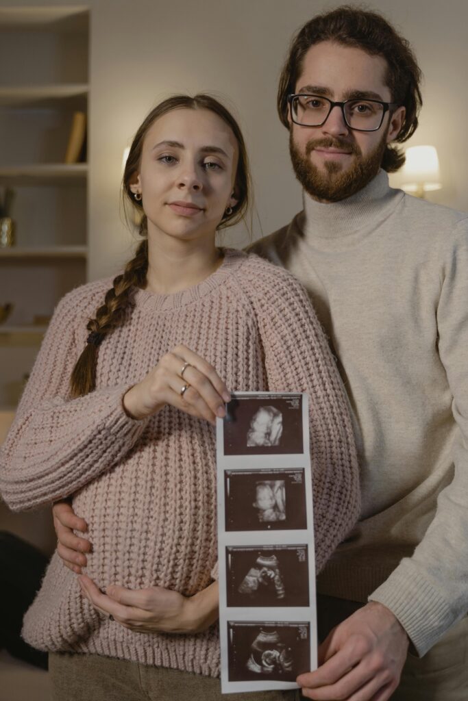 pexels-photo-6463180-6463180 Portrait of a Couple Holding an Ultrasound Picture