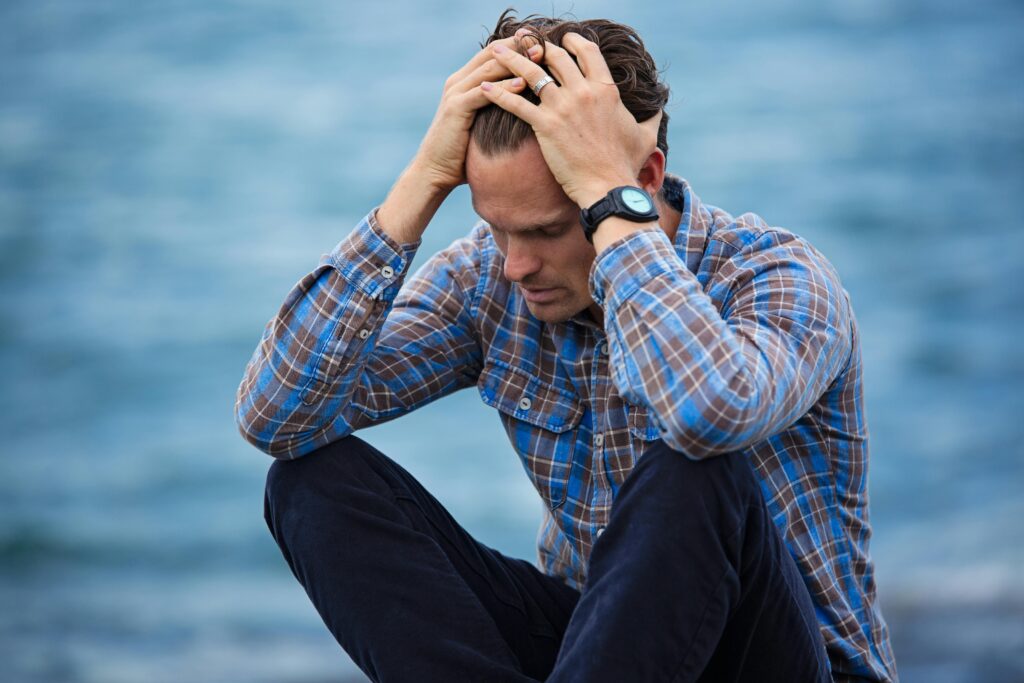 pexels-photo-897817-897817 Man in Blue and Brown Plaid Dress Shirt Touching His Hair